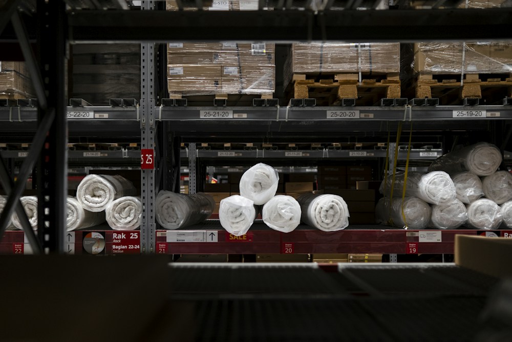 Organised warehouse aisles with stored packaged goods